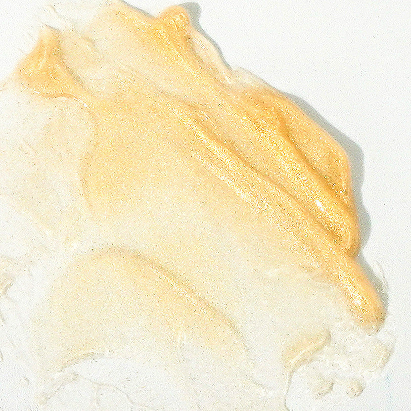 Gelée pailletée Dorésun qui illumine, hydrate et sublime le bronzage. Fini doré naturel pour le visage et le corps. Parfum inspiration Dior.